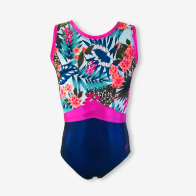 A short sleeve leotard with a bright tropical pattern on top, a shiny deep blue bottom, and hot pink highlights